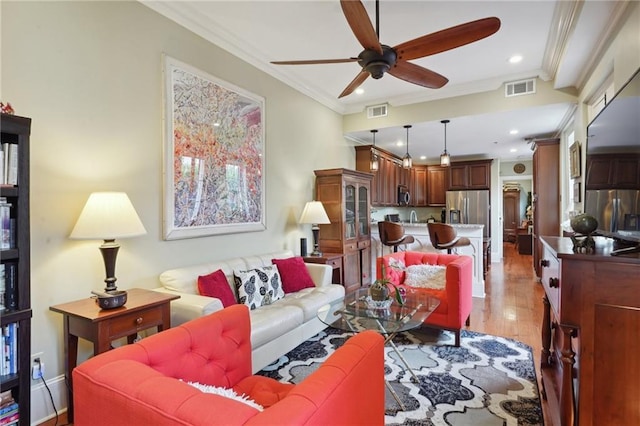 1225 Bourbon St Unit F, New Orleans, LA 70116 - living room featuring ceiling fan, crown molding, light wood-style flooring, and recessed lighting