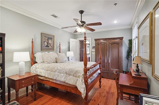 1225 Bourbon St Unit F, New Orleans, LA 70116 - bedroom with light wood-style flooring, crown molding, recessed lighting, and a ceiling fan