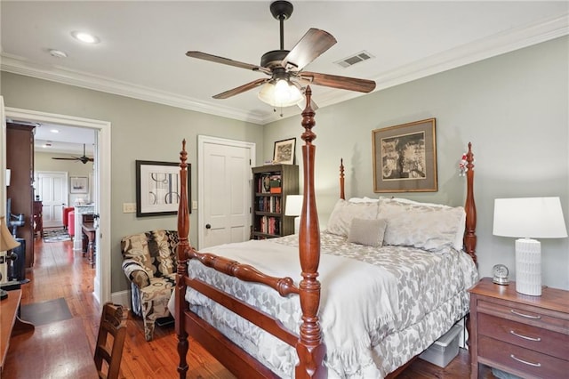 1225 Bourbon St Unit F, New Orleans, LA 70116 - bedroom featuring wood-type flooring, ornamental molding, ceiling fan, and recessed lighting