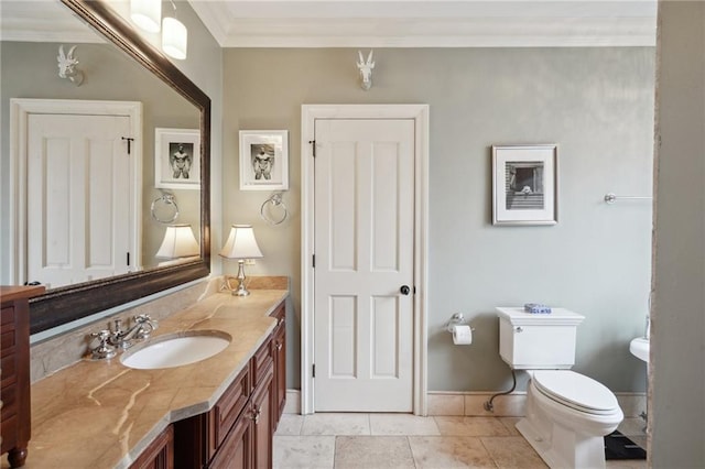 1225 Bourbon St Unit F, New Orleans, LA 70116 - bathroom featuring vanity, ornamental molding, and tile patterned floors