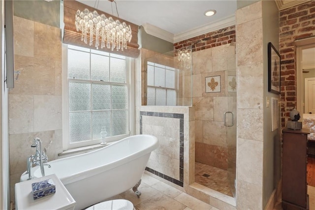 1225 Bourbon St Unit F, New Orleans, LA 70116 - full bathroom featuring a soaking tub, a shower stall, tile walls, plenty of natural light, and ornamental molding