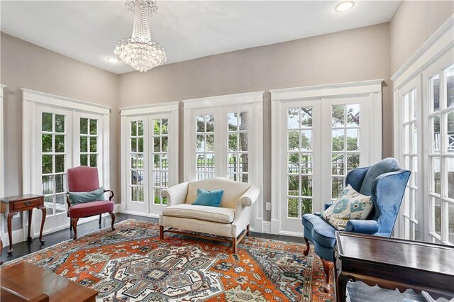 5024 S Claiborne Ave, New Orleans, LA 70125 - sunroom / solarium featuring french doors, a chandelier, and healthy amount of natural light
