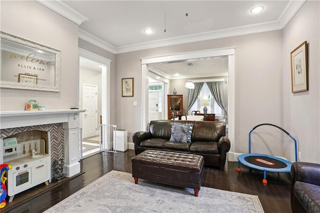 5024 S Claiborne Ave, New Orleans, LA 70125 - living room featuring dark wood-type flooring, ornamental molding, and recessed lighting