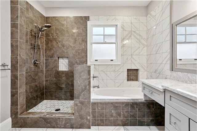 5024 S Claiborne Ave, New Orleans, LA 70125 - bathroom featuring vanity, a bath, a tile shower, healthy amount of natural light, and tile walls