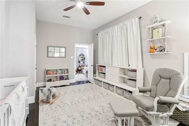 5024 S Claiborne Ave, New Orleans, LA 70125 - bedroom with wood finished floors and ceiling fan