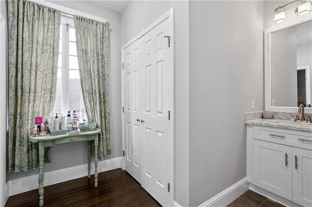 5024 S Claiborne Ave, New Orleans, LA 70125 - bathroom with vanity and wood finished floors