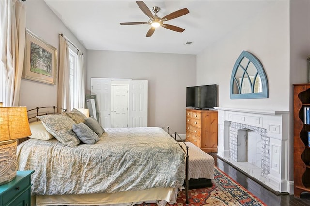 5024 S Claiborne Ave, New Orleans, LA 70125 - bedroom with wood finished floors and a ceiling fan