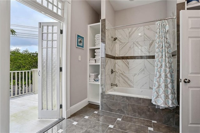 5024 S Claiborne Ave, New Orleans, LA 70125 - full bathroom with tiled shower / bath combo and plenty of natural light