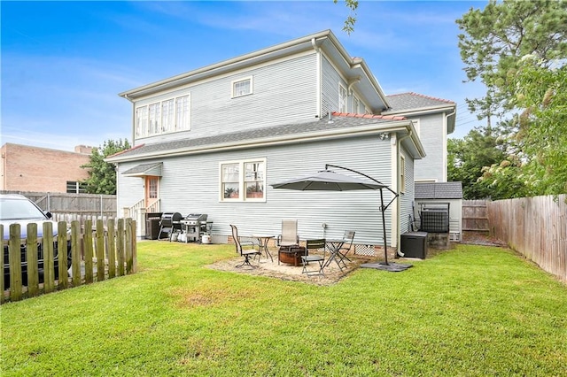 5024 S Claiborne Ave, New Orleans, LA 70125 - rear view of house featuring a fire pit and a fenced backyard