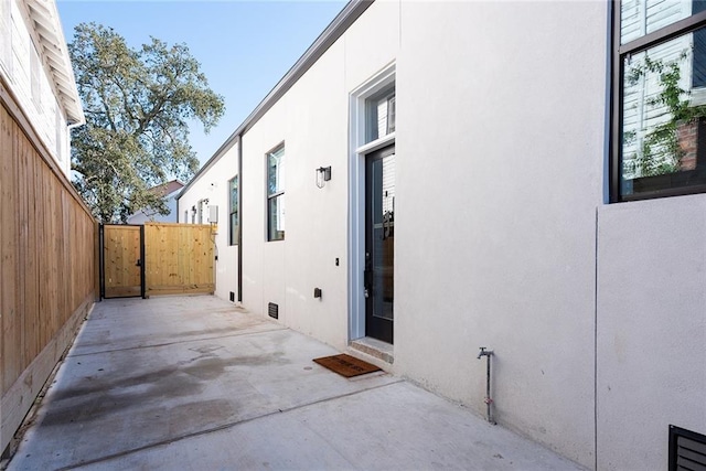 424 S Lopez St, New Orleans, LA 70119 - view of patio with a gate
