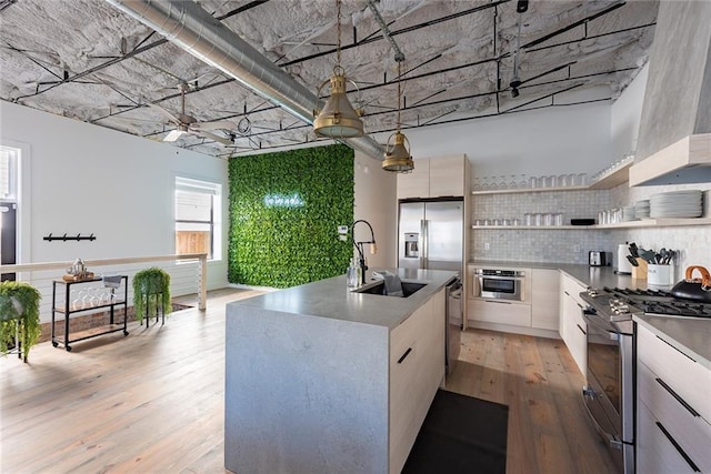 424 S Lopez St, New Orleans, LA 70119 - kitchen with appliances with stainless steel finishes, modern cabinets, open shelves, and light wood-type flooring