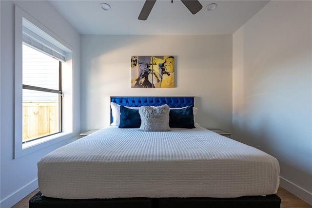 424 S Lopez St, New Orleans, LA 70119 - bedroom featuring multiple windows, wood finished floors, and a ceiling fan