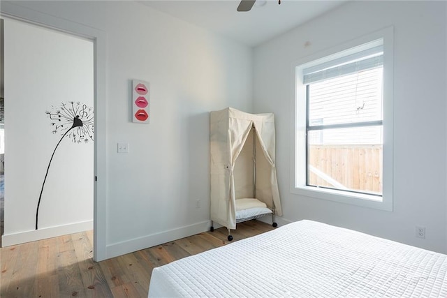 424 S Lopez St, New Orleans, LA 70119 - bedroom with wood finished floors and ceiling fan