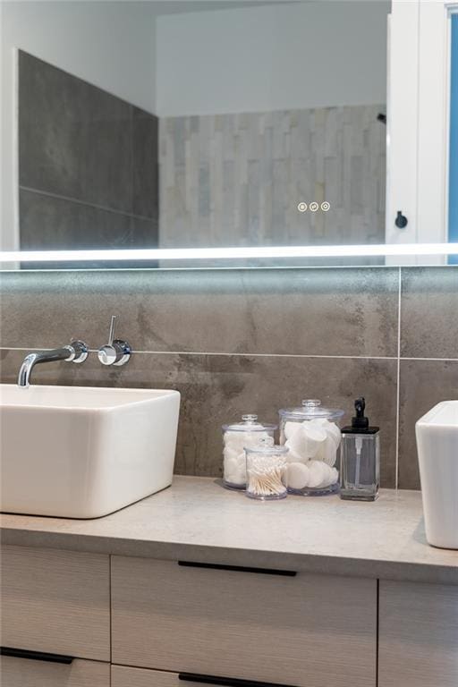 424 S Lopez St, New Orleans, LA 70119 - bathroom featuring vanity and decorative backsplash