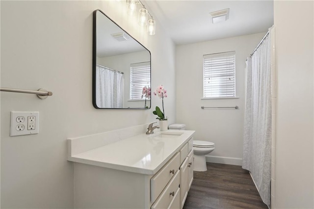920 Hesper Ave, Metairie, LA 70005 - full bath with vanity, wood finished floors, and a shower with shower curtain