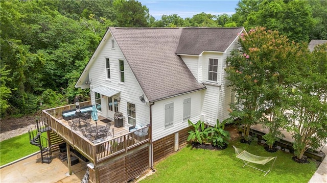 921 Carriage Way, Baton Rouge, LA 70808 - back of house with a shingled roof, a wooden deck, and a lawn