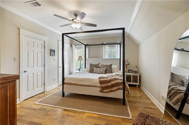 921 Carriage Way, Baton Rouge, LA 70808 - bedroom with crown molding, light wood-style floors, arched walkways, and ceiling fan