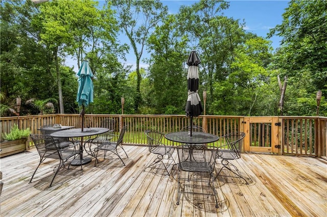 921 Carriage Way, Baton Rouge, LA 70808 - wooden terrace with outdoor dining space and view of scattered trees
