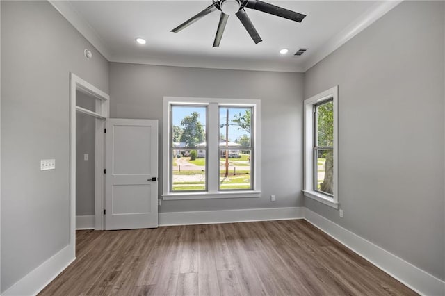 163 S 7th St, Ponchatoula, LA 70454 - unfurnished bedroom featuring wood finished floors, crown molding, and a ceiling fan