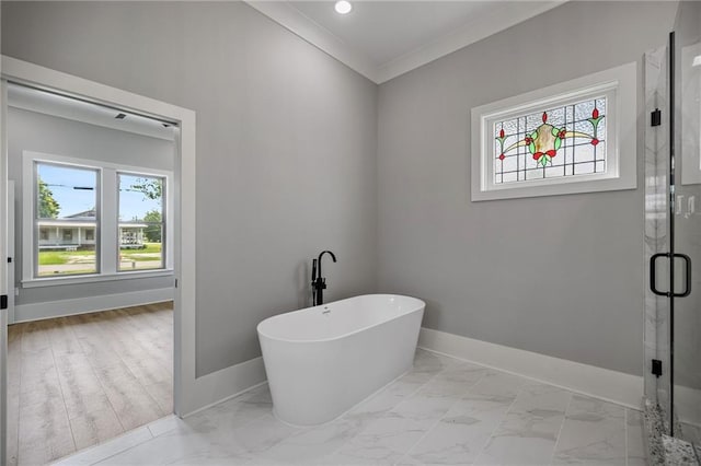 163 S 7th St, Ponchatoula, LA 70454 - bathroom with a freestanding bath, a shower stall, ornamental molding, and marble look tiles