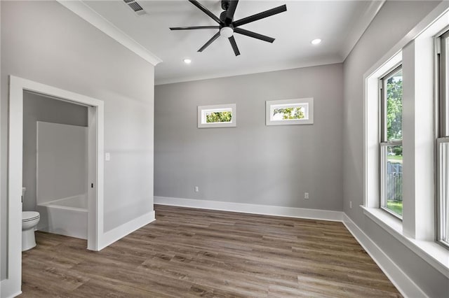 163 S 7th St, Ponchatoula, LA 70454 - empty room with plenty of natural light, ornamental molding, dark wood-style flooring, a ceiling fan, and recessed lighting