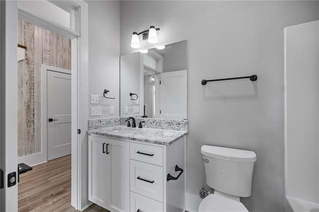 163 S 7th St, Ponchatoula, LA 70454 - full bathroom featuring vanity and wood finished floors