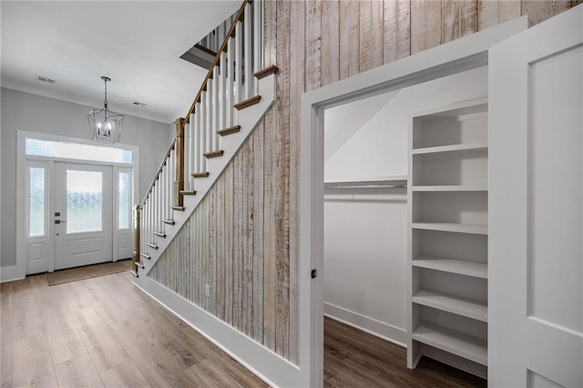 163 S 7th St, Ponchatoula, LA 70454 - entrance foyer with wood finished floors, a chandelier, and stairs