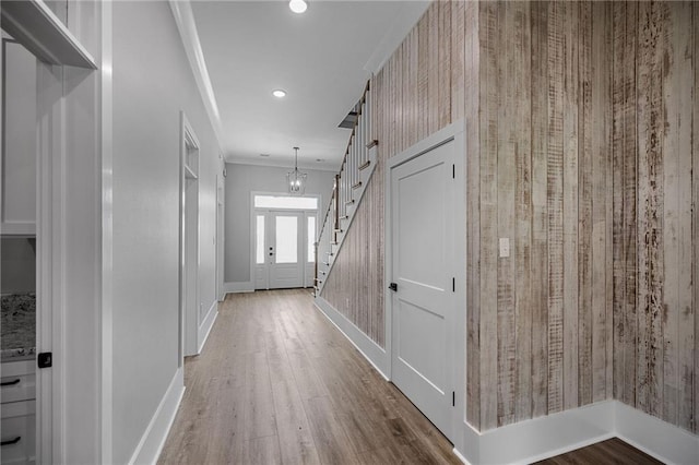 163 S 7th St, Ponchatoula, LA 70454 - hallway featuring crown molding, wood finished floors, recessed lighting, stairs, and a chandelier