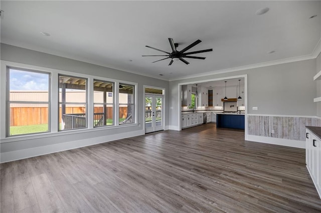 163 S 7th St, Ponchatoula, LA 70454 - unfurnished living room featuring a ceiling fan, dark wood-style flooring, and ornamental molding