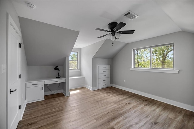 163 S 7th St, Ponchatoula, LA 70454 - bonus room featuring vaulted ceiling, wood finished floors, a ceiling fan, and an office area