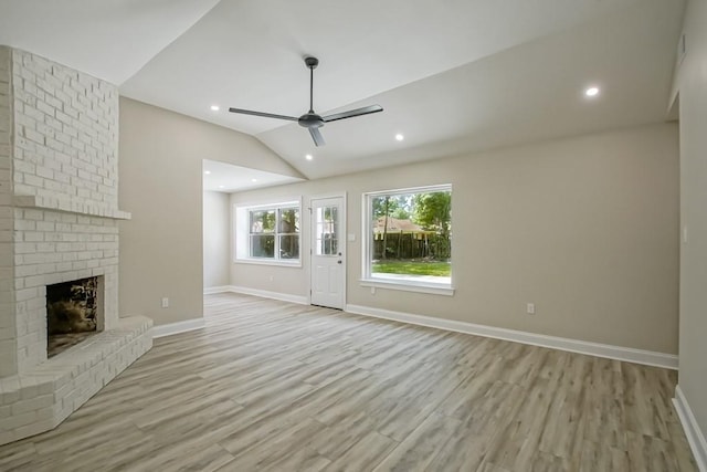 217 Chess Dr, Slidell, LA 70458 - unfurnished living room with ceiling fan, light wood-style flooring, lofted ceiling, a brick fireplace, and recessed lighting