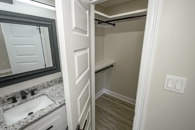 217 Chess Dr, Slidell, LA 70458 - bathroom with vanity and wood finished floors