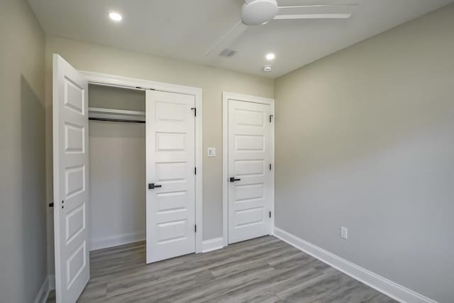 217 Chess Dr, Slidell, LA 70458 - unfurnished bedroom featuring wood finished floors, a closet, recessed lighting, and ceiling fan