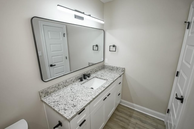 217 Chess Dr, Slidell, LA 70458 - half bath featuring vanity and wood finished floors