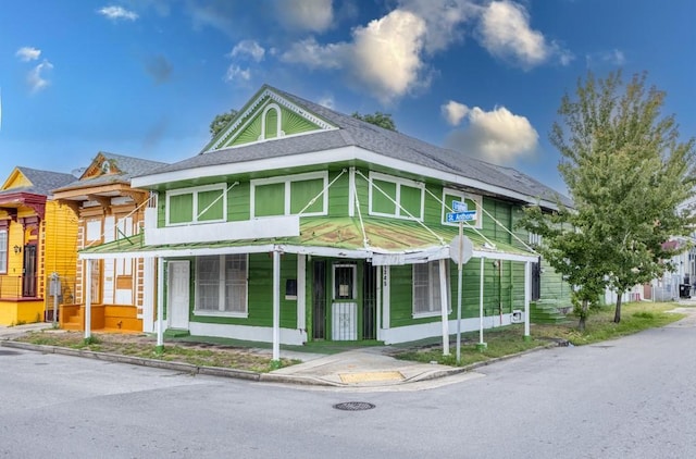 1345 Saint Anthony St, New Orleans, LA 70116 - view of front of home featuring roof with shingles