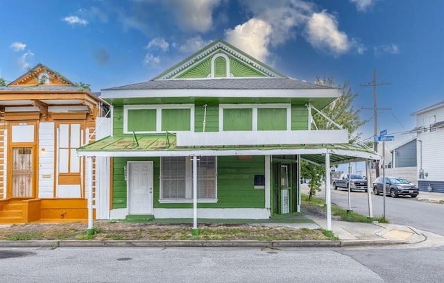 1345 Saint Anthony St, New Orleans, LA 70116 - view of front of property with roof with shingles and covered porch