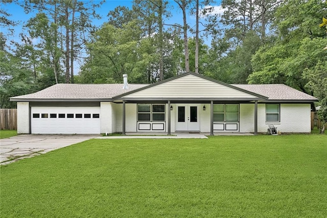 11 Karen Dr, Covington, LA 70433 - view of front of home with concrete driveway, an attached garage, french doors, and brick siding