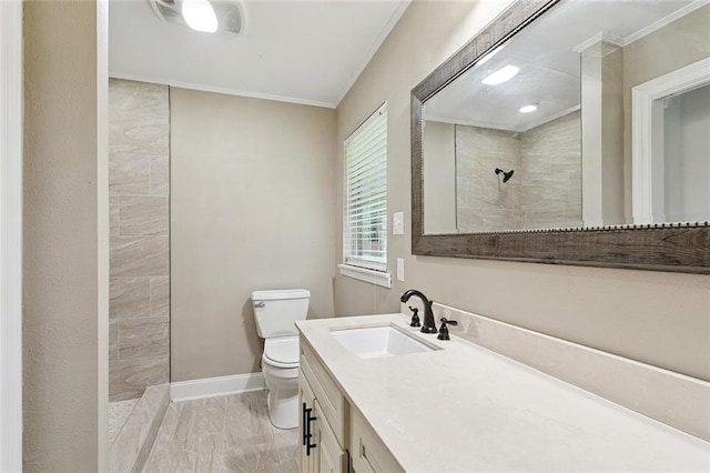 11 Karen Dr, Covington, LA 70433 - bathroom featuring marble finish floors, a tile shower, vanity, and crown molding