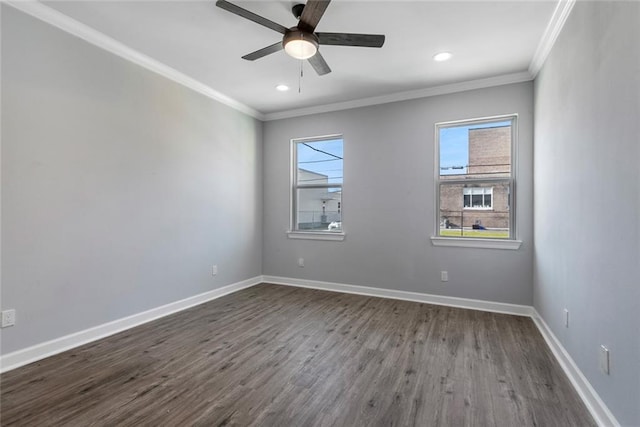 2626 N Dorgenois St, New Orleans, LA 70117 - spare room featuring crown molding, dark wood finished floors, ceiling fan, and recessed lighting