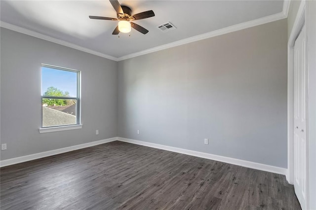 2626 N Dorgenois St, New Orleans, LA 70117 - empty room featuring dark wood finished floors, a ceiling fan, and ornamental molding