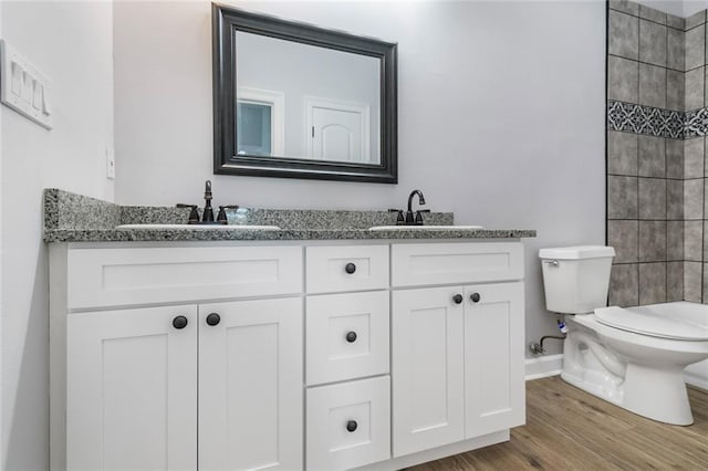 2626 N Dorgenois St, New Orleans, LA 70117 - full bathroom with double vanity, wood finished floors, and a tile shower