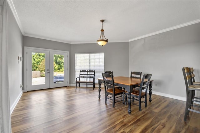 109 Topsl Dr Unit 109, Mandeville, LA 70448 - dining space with dark wood-type flooring, ornamental molding, french doors, and a textured ceiling