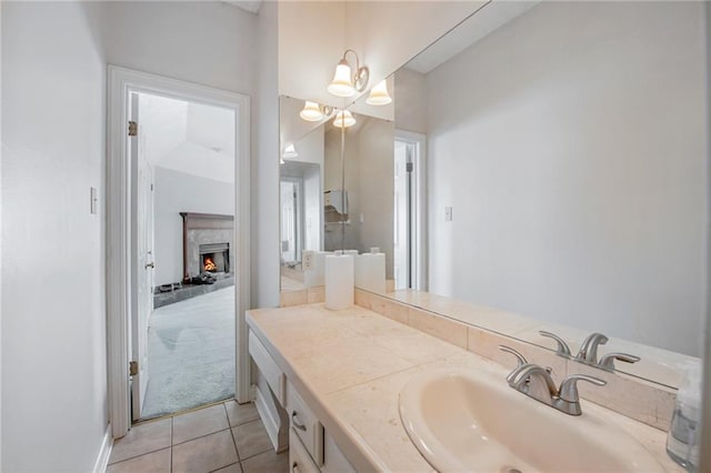 109 Topsl Dr Unit 109, Mandeville, LA 70448 - bathroom featuring tile patterned flooring, vanity, and a premium fireplace