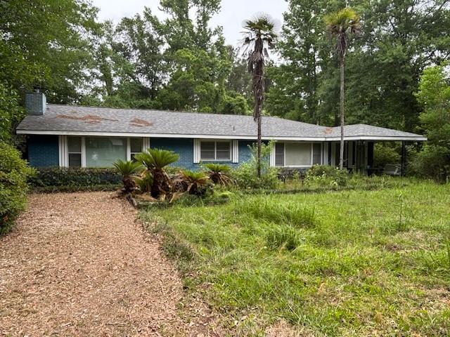 19343 9th Ave, Covington, LA 70433 - ranch-style house with a chimney and view of scattered trees