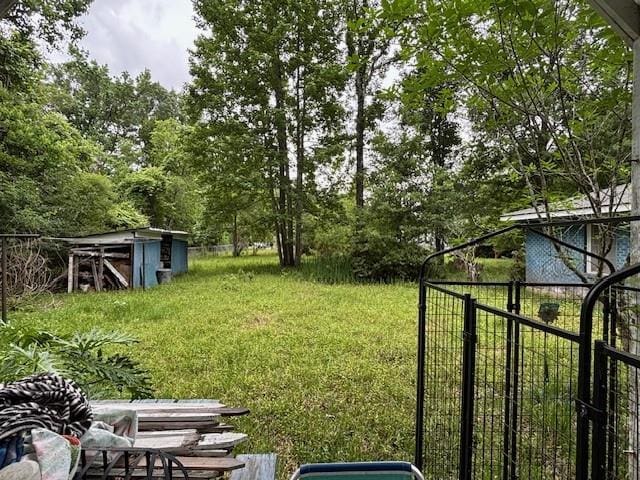 19343 9th Ave, Covington, LA 70433 - view of yard featuring a storage unit