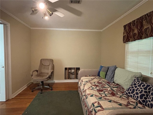 19343 9th Ave, Covington, LA 70433 - bedroom featuring wood finished floors, crown molding, and ceiling fan