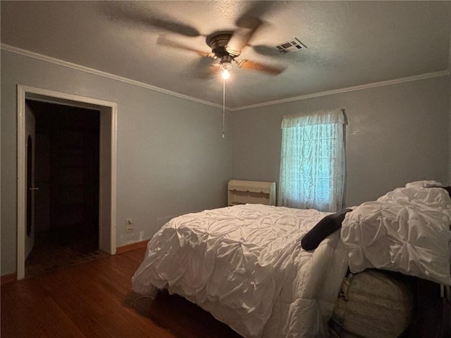 19343 9th Ave, Covington, LA 70433 - bedroom featuring wood finished floors, ornamental molding, a ceiling fan, and a textured ceiling