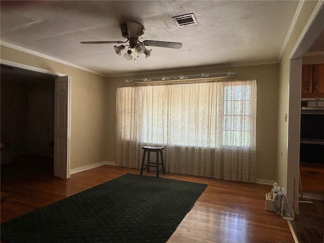 19343 9th Ave, Covington, LA 70433 - unfurnished room featuring ceiling fan, crown molding, and wood finished floors