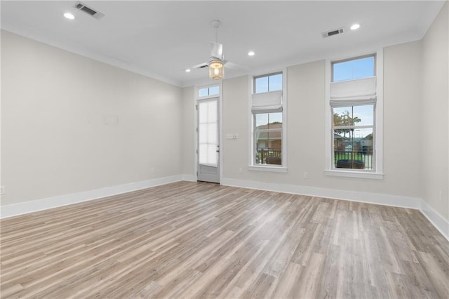 2028 Charles Dr, Chalmette, LA 70043 - unfurnished room with plenty of natural light, light wood-style floors, recessed lighting, ceiling fan, and ornamental molding