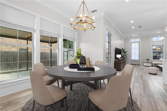 2028 Charles Dr, Chalmette, LA 70043 - dining area featuring a chandelier, light wood finished floors, and recessed lighting